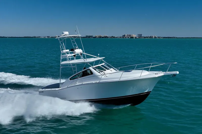 Slide: The Image of 2004 Luhrs Tournament 320 Open cruising on clear blue waters. - 55