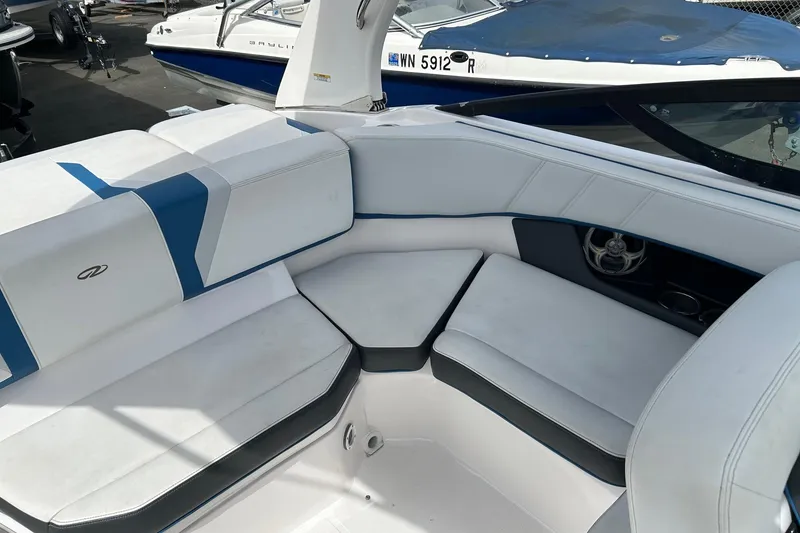 Slide: The Image of 2015 Regal 2000 ESX Bowrider interior with white and blue seating, showcasing modern design. - 10