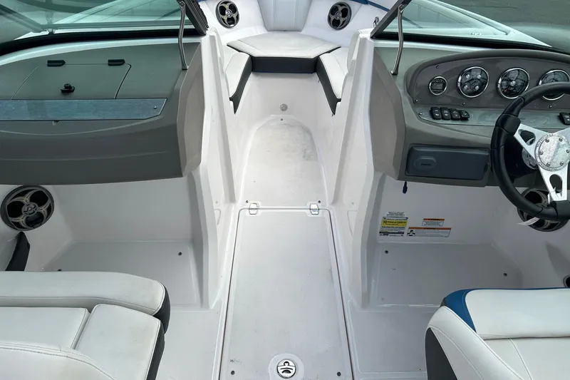 Slide: The Image of Interior view of a 2015 Regal 2000 ESX Bowrider boat cockpit and seating area. - 12