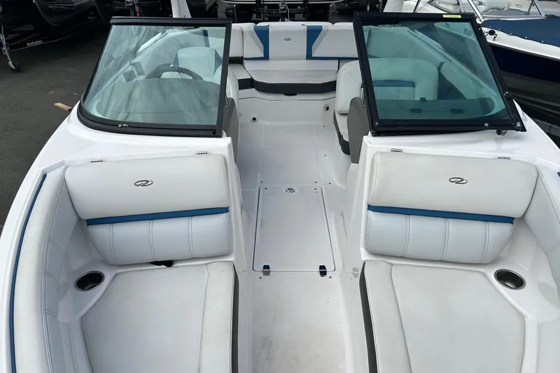 Slide: The Image of 2015 Regal 2000 ESX Bowrider interior with white and blue seating, open windshield. - 14
