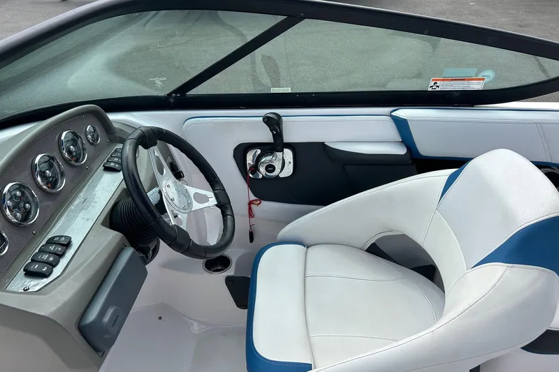 Slide: The Image of Interior of 2015 Regal 2000 ESX Bowrider boat with steering wheel and dashboard. - 5