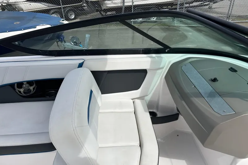 Slide: The Image of 2015 Regal 2000 ESX Bowrider interior with white seating and dashboard. - 6