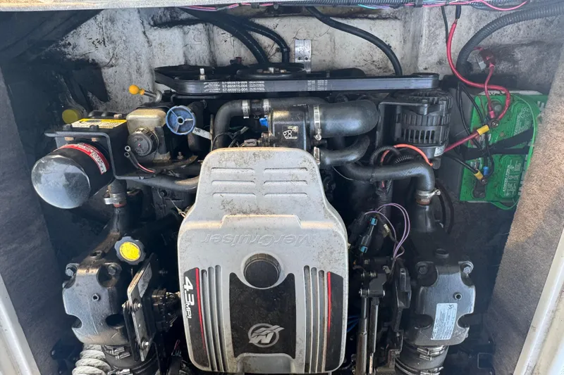 Slide: The Image of Engine compartment of a 2009 Tahoe 216 I/O WT boat, featuring a MerCruiser 4.3 MPI engine. - 11