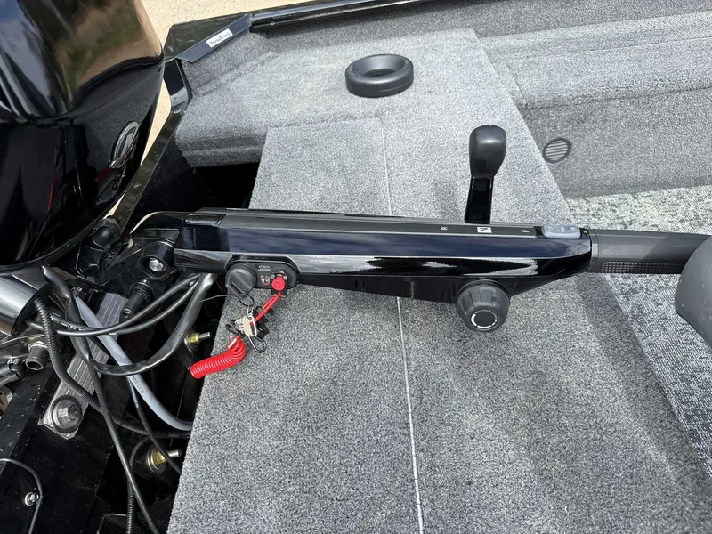 Slide: The Image of 2025 Tracker Super Guide V16 Tiller control and engine view. - 10