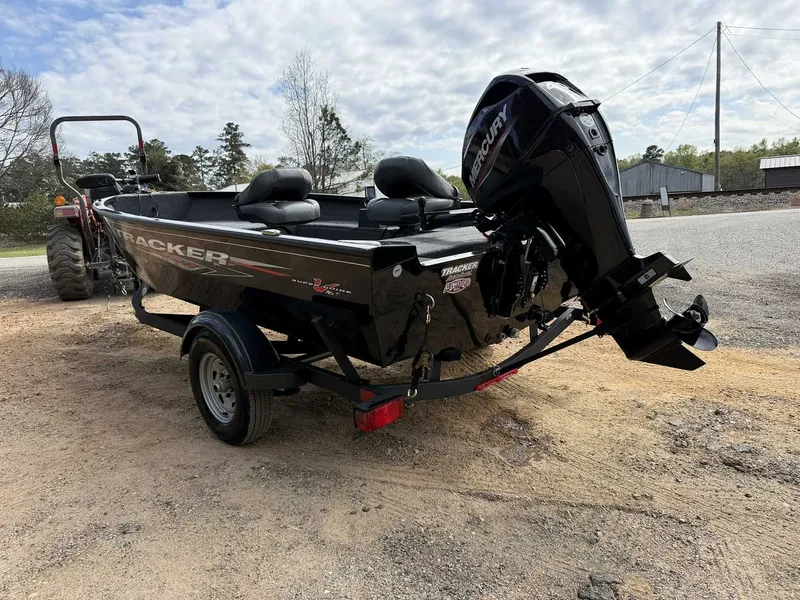 Slide: The Image of 2025 Tracker Super Guide V16 Tiller with Mercury 40 trailer. - 3