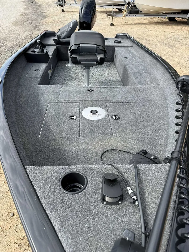 Slide: The Image of 2025 Tracker Super Guide V16 Tiller boat with gray interior. - 8