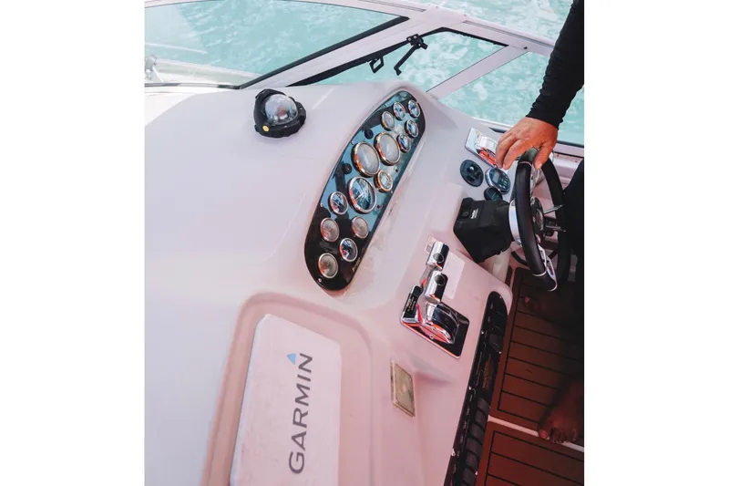 Slide: The Image of Helm of 2001 Sea Ray 360 Express Cruiser with Garmin navigation system and gauges. - 16