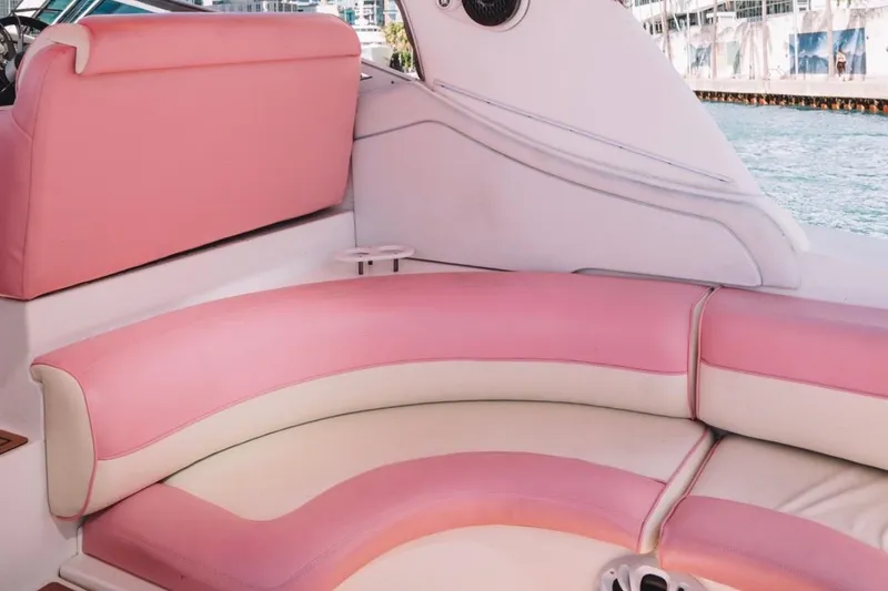 Slide: The Image of Pink and white seating on a 2001 Sea Ray 360 Express Cruiser boat. - 19