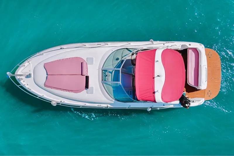 Slide: The Image of Overhead view of 2001 Sea Ray 360 Express Cruiser on turquoise water. - 2