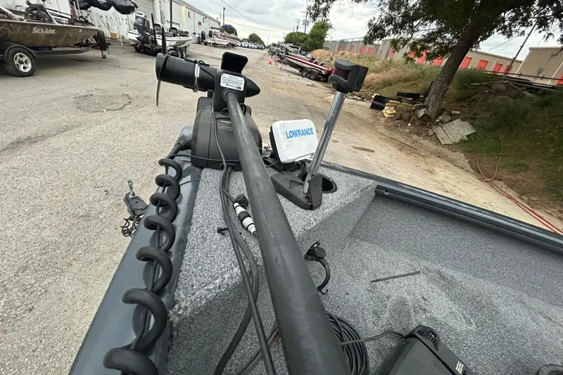 Slide: The Image of 2021 Tracker Pro Guide V-16 SC boat with Lowrance equipment, parked outdoors. - 12