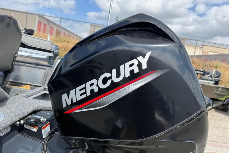 Slide: The Image of Mercury FourStroke engine on 2021 Tracker Pro Guide V-16 SC boat, outdoor setting. - 19