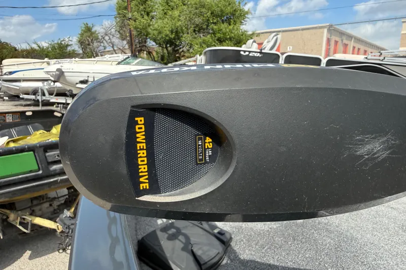 Slide: The Image of Minn Kota PowerDrive motor on 2021 Tracker Pro Guide V-16 SC boat, outdoor setting. - 24