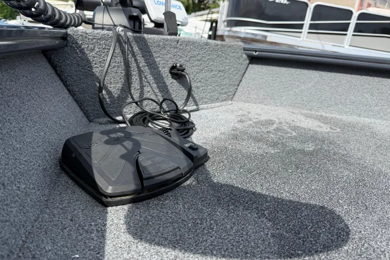 Slide: The Image of 2021 Tracker Pro Guide V-16 SC boat interior with foot pedal and wiring. - 25