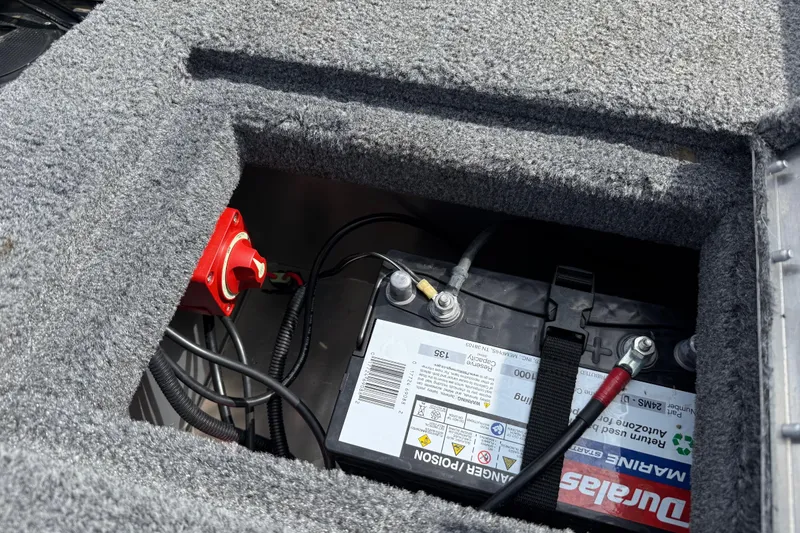 Slide: The Image of Battery compartment of 2021 Tracker Pro Guide V-16 SC boat with wiring and switch. - 27