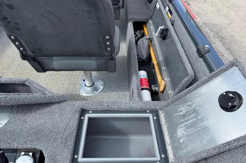 Slide: The Image of 2021 Tracker Pro Guide V-16 SC boat interior with storage compartments and seating. - 29