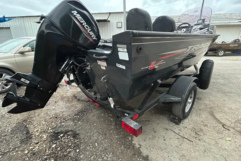 Slide: The Image of 2021 Tracker Pro Guide V-16 SC boat with Mercury engine on trailer. - 3