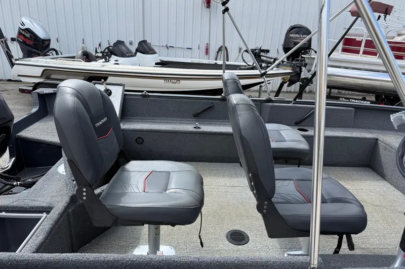 Slide: The Image of 2021 Tracker Pro Guide V-16 SC boat interior with two cushioned seats. - 30