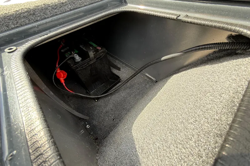 Slide: The Image of Battery compartment of 2021 Tracker Pro Guide V-16 SC boat, featuring secure wiring. - 37