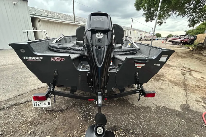 Slide: The Image of 2021 Tracker Pro Guide V-16 SC boat on trailer, rear view, outdoor setting. - 4