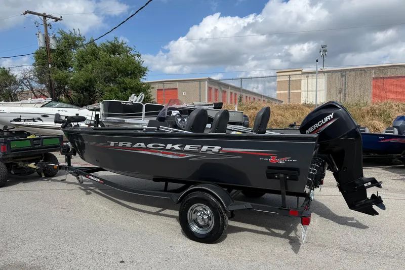 Slide: The Image of 2021 Tracker Pro Guide V-16 SC boat with Mercury engine on trailer. - 42