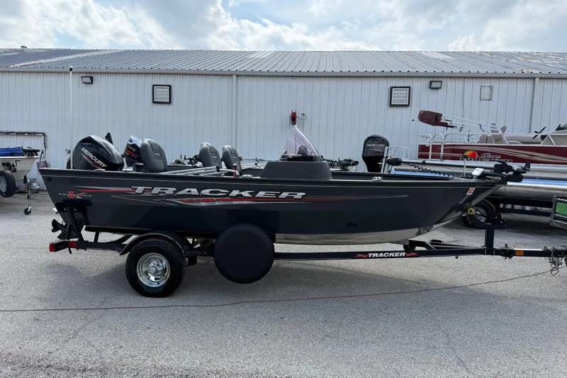 Slide: The Image of 2021 Tracker Pro Guide V-16 SC boat on trailer, parked outdoors. - 44