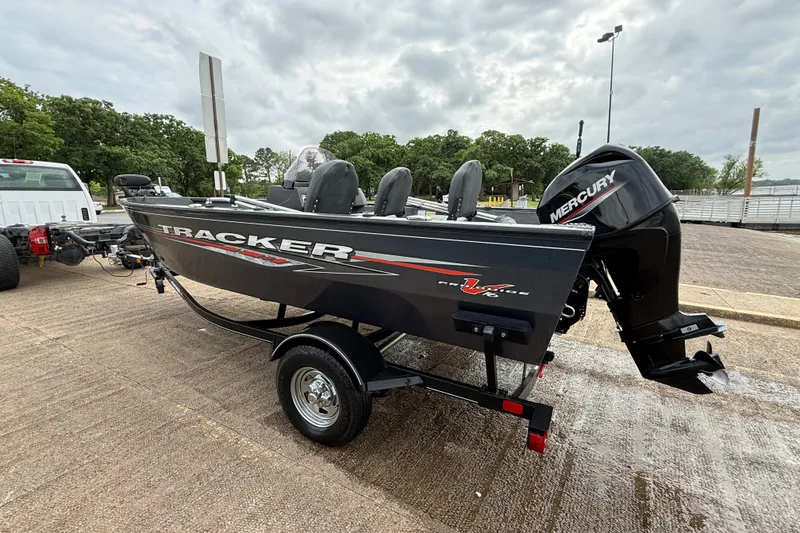 Slide: The Image of 2021 Tracker Pro Guide V-16 SC boat on trailer with Mercury outboard motor. - 53