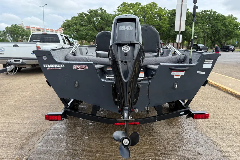 Slide: The Image of 2021 Tracker Pro Guide V-16 SC boat on trailer, rear view with motor. - 55