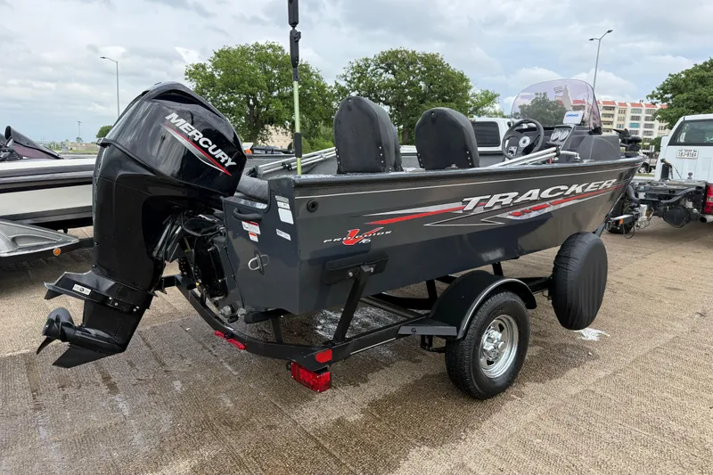 Slide: The Image of 2021 Tracker Pro Guide V-16 SC boat with Mercury outboard motor on trailer. - 56