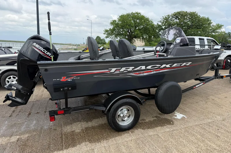 Slide: The Image of 2021 Tracker Pro Guide V-16 SC boat on trailer with Mercury outboard motor. - 57