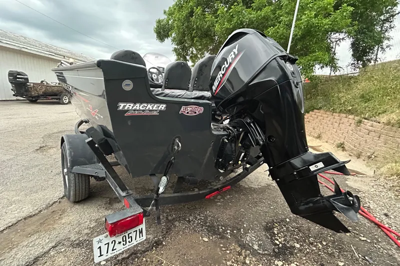 Slide: The Image of 2021 Tracker Pro Guide V-16 SC boat with Mercury outboard motor on trailer. - 6