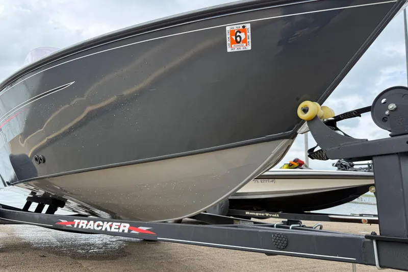 Slide: The Image of 2021 Tracker Pro Guide V-16 SC boat on trailer, close-up view. - 60