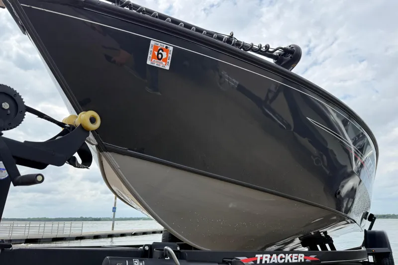 Slide: The Image of 2021 Tracker Pro Guide V-16 SC boat on trailer, dockside view. - 64