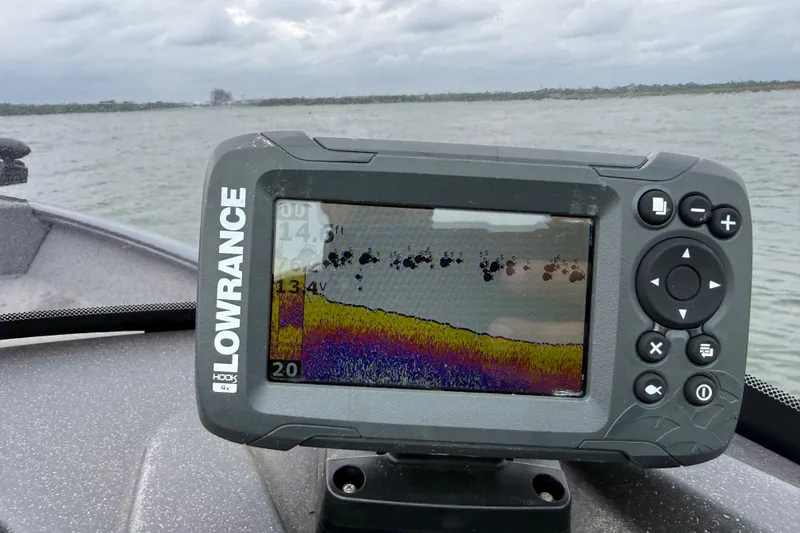 Slide: The Image of Lowrance fish finder on 2021 Tracker Pro Guide V-16 SC boat, displaying underwater sonar data. - 65