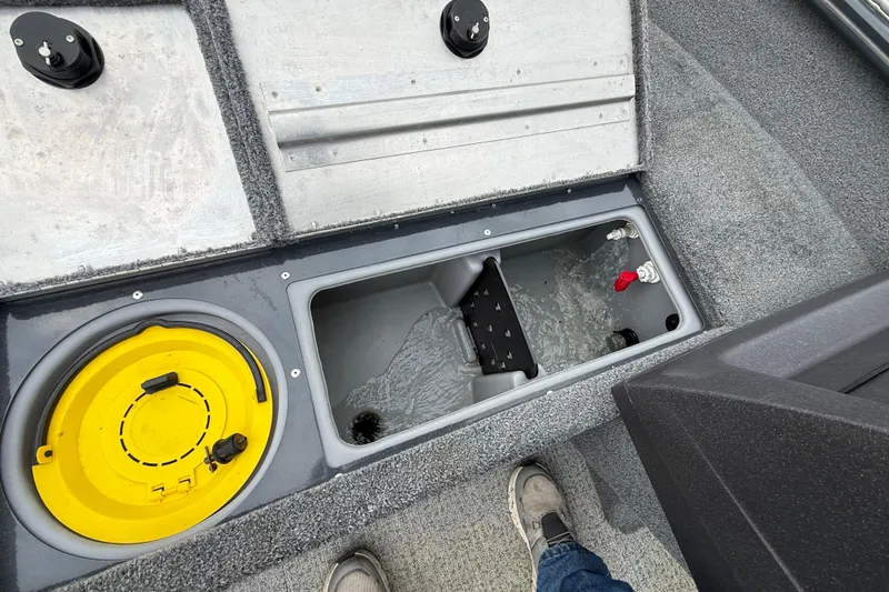 Slide: The Image of 2021 Tracker Pro Guide V-16 SC boat interior with storage compartments and livewell. - 66