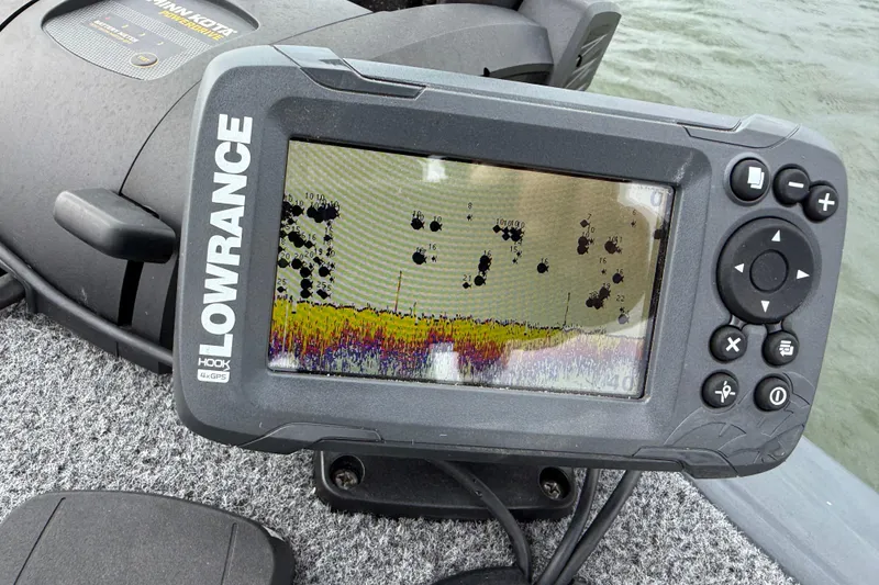 Slide: The Image of Lowrance fish finder on 2021 Tracker Pro Guide V-16 SC boat, displaying underwater sonar data. - 68