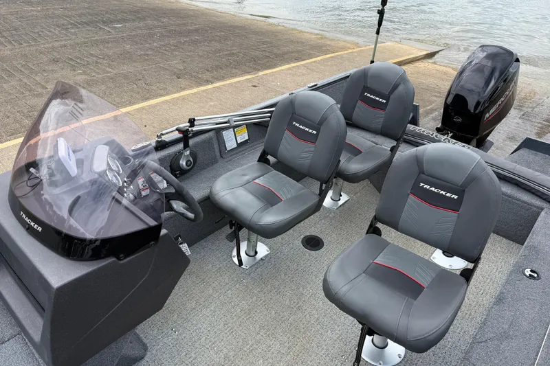 Slide: The Image of 2021 Tracker Pro Guide V-16 SC boat interior with seating and controls. - 71