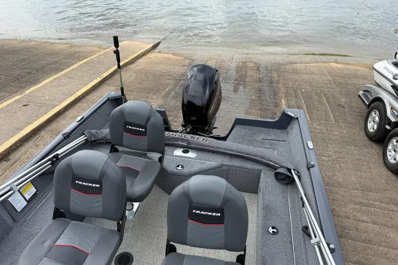 Slide: The Image of 2021 Tracker Pro Guide V-16 SC boat at a boat ramp, ready for launch. - 72