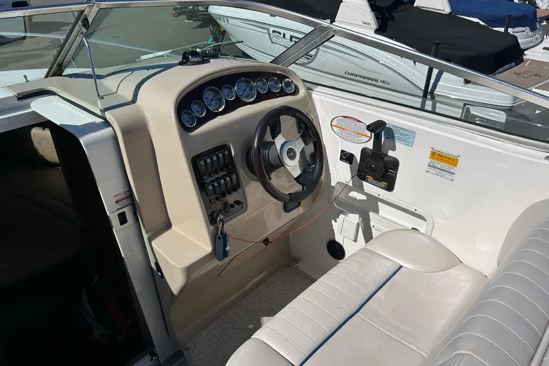 Slide: The Image of 2001 Chaparral Signature 240 boat cockpit with steering wheel and control panel. - 22