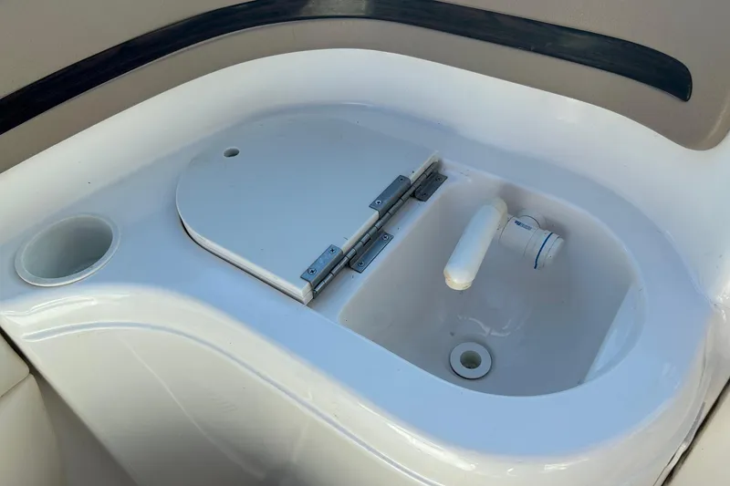 Slide: The Image of 2001 Chaparral 235 SSi boat sink with cover and cup holder. - 12