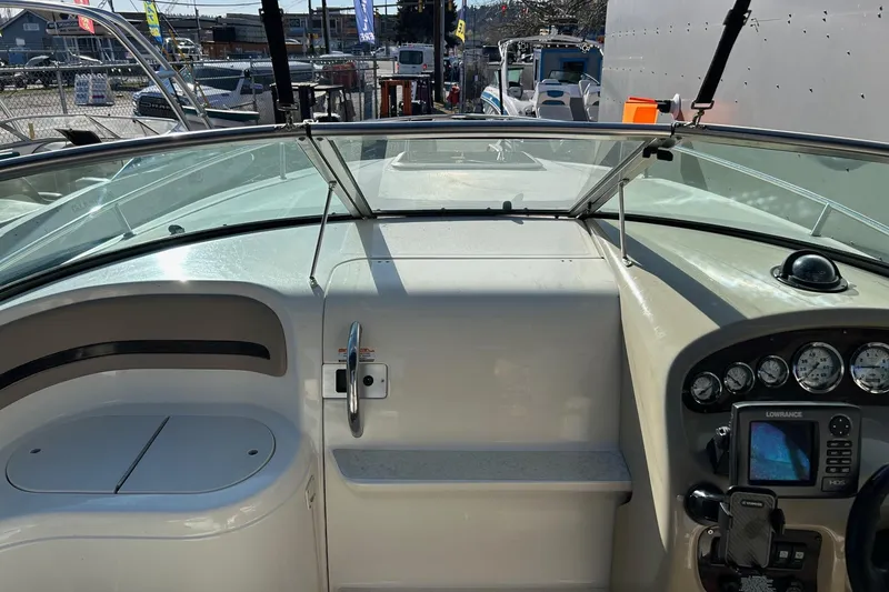 Slide: The Image of 2001 Chaparral 235 SSi boat dashboard with gauges and navigation equipment. - 13