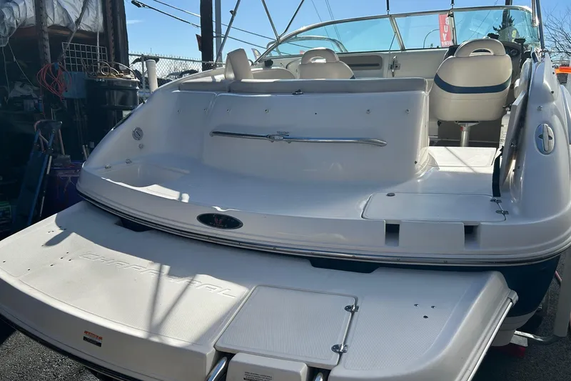 Slide: The Image of 2001 Chaparral 235 SSi boat, rear view, showcasing spacious deck and seating area. - 3