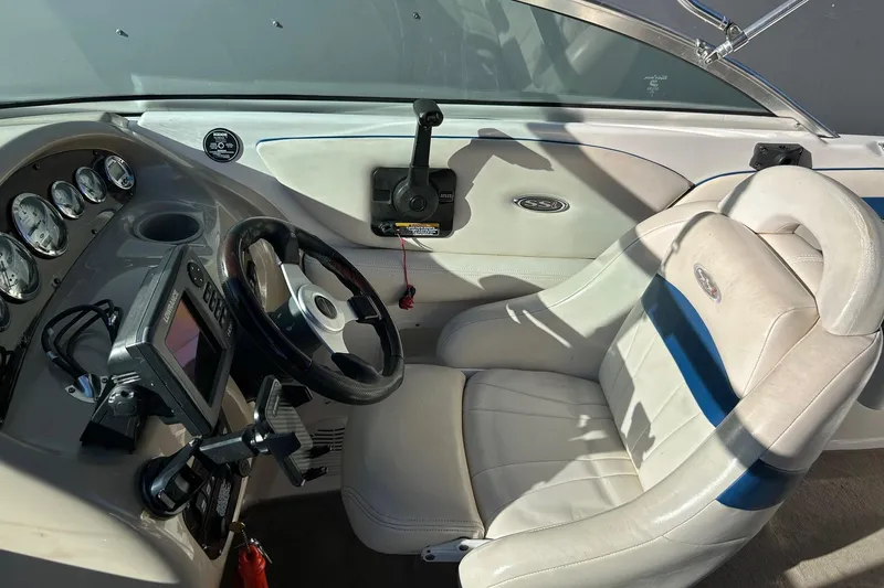 Slide: The Image of Interior of a 2001 Chaparral 235 SSi boat showing steering wheel and dashboard controls. - 6