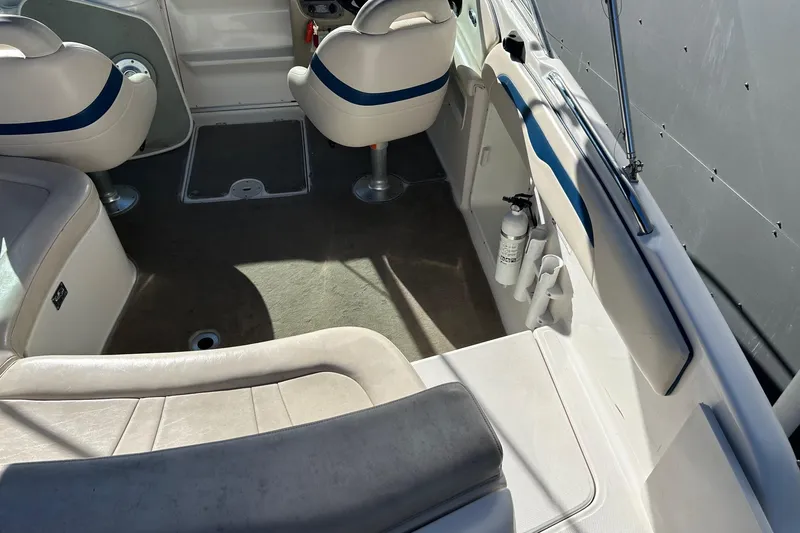 Slide: The Image of Interior of a 2001 Chaparral 235 SSi boat with seating and safety equipment. - 7