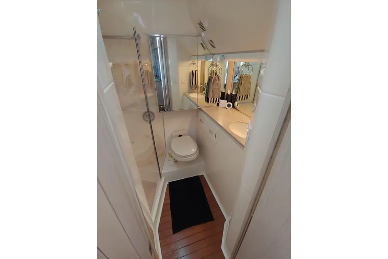 Slide: The Image of Luxurious interior of a 1995 Tiara Yachts 4300 Open with elegant seating and decor. - 12