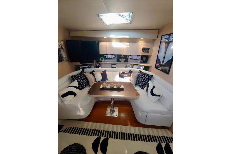 Slide: The Image of Luxurious interior of a 1995 Tiara Yachts 4300 Open with elegant seating and decor. - 13