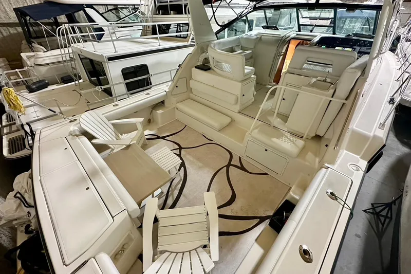 Slide: The Image of 1995 Tiara Yachts 4300 Open interior with seating and helm, showcasing luxury design. - 16