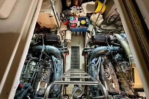 Slide: The Image of 1995 Tiara Yachts 4300 Open engine room with dual engines. - 32