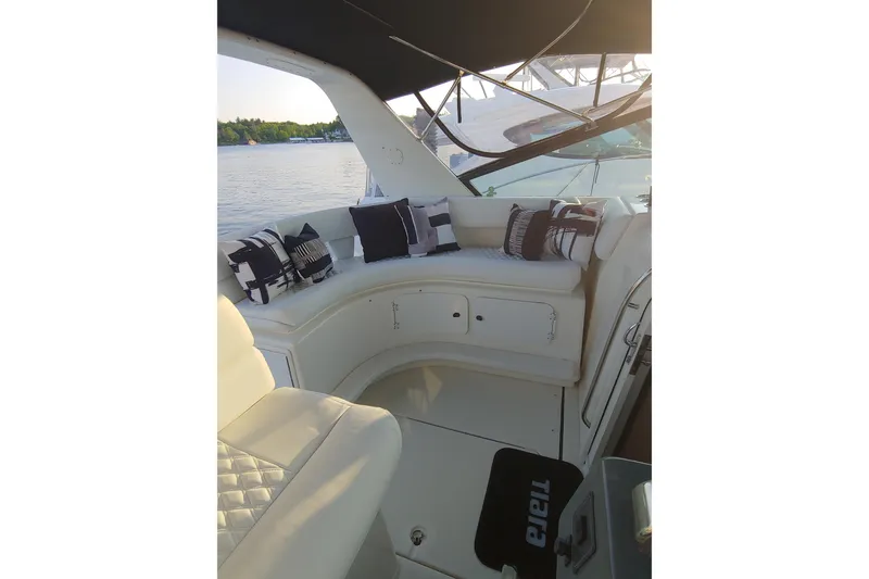 Slide: The Image of Interior of 1995 Tiara Yachts 4300 Open, featuring elegant seating and nautical-themed decor. - 6