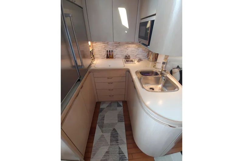 Slide: The Image of 1995 Tiara Yachts 4300 Open cockpit with helm, seating, and navigation equipment. - 8