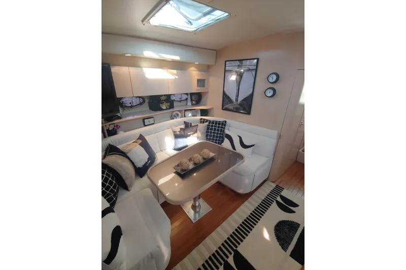Slide: The Image of Luxurious interior of 1995 Tiara Yachts 4300 Open with modern decor and comfortable seating. - 9